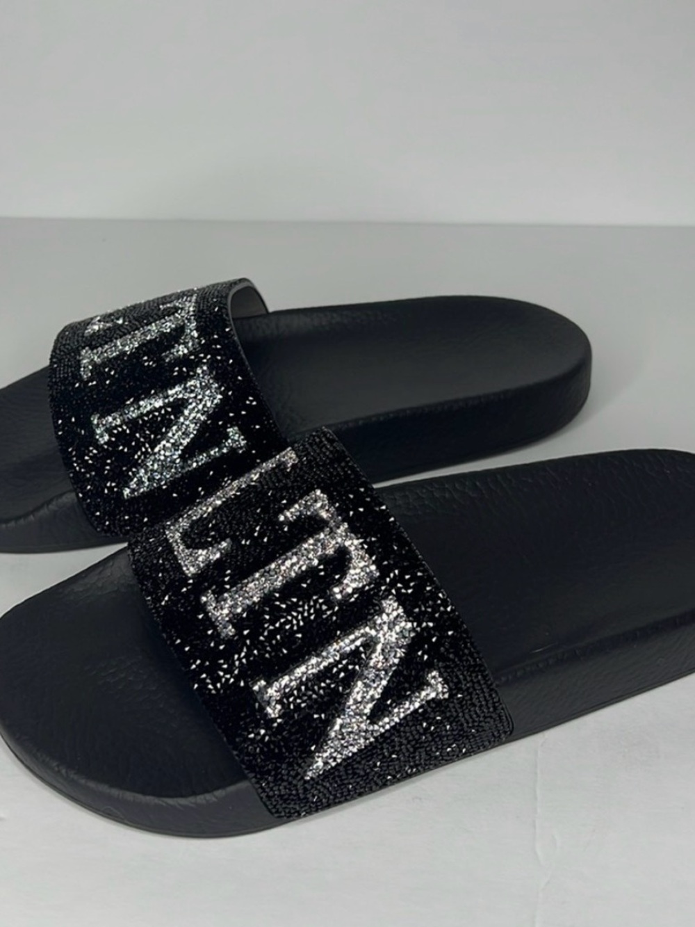 Valentino Garavani Black Glitter Slide Sandals with Silver Lettering